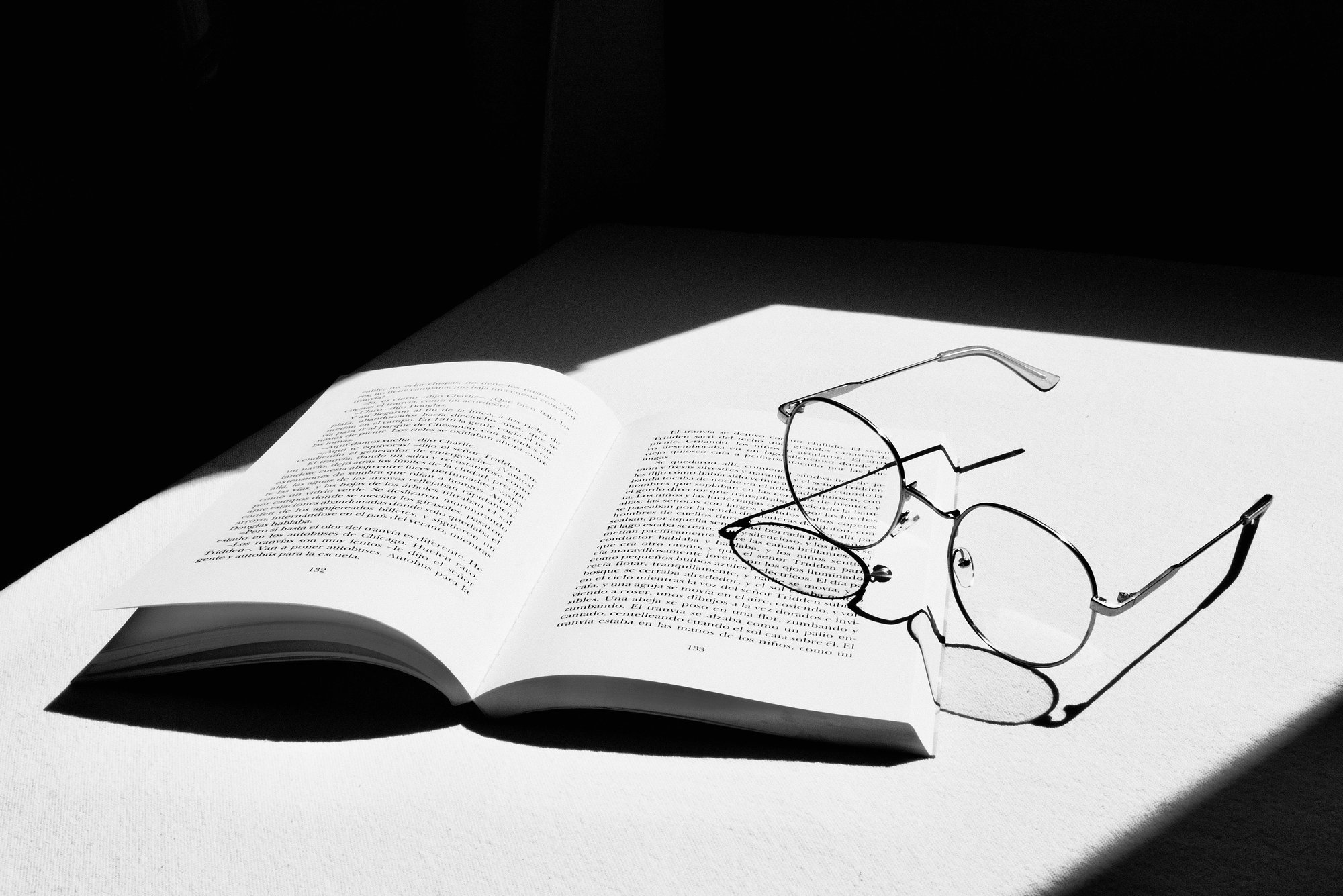 books and glasses on a table